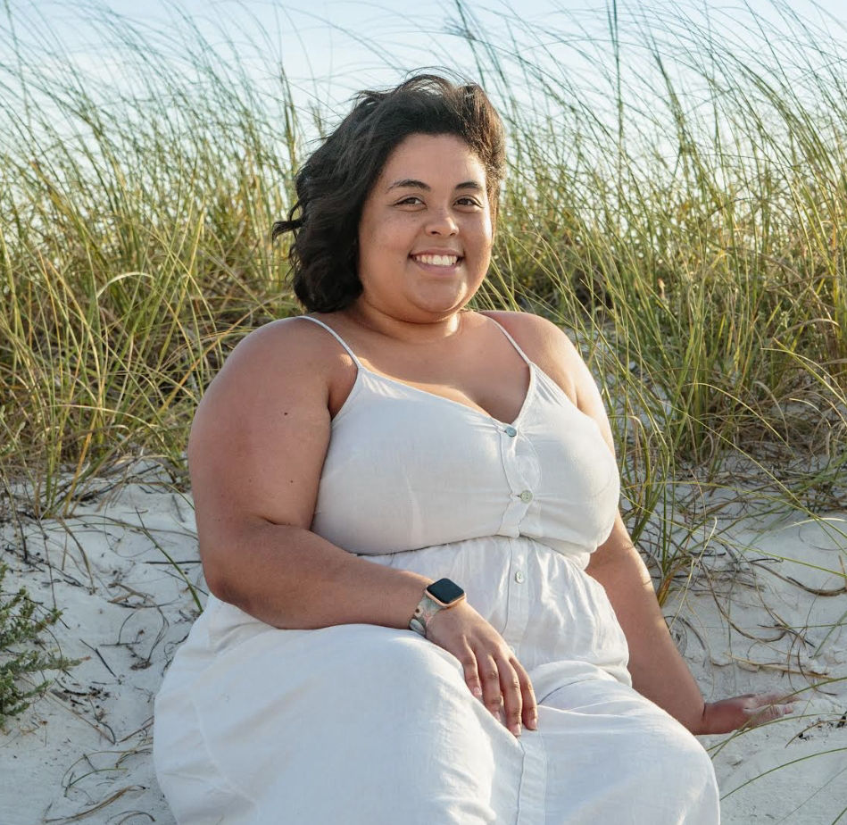 Jaya Palmer sitting on the beach